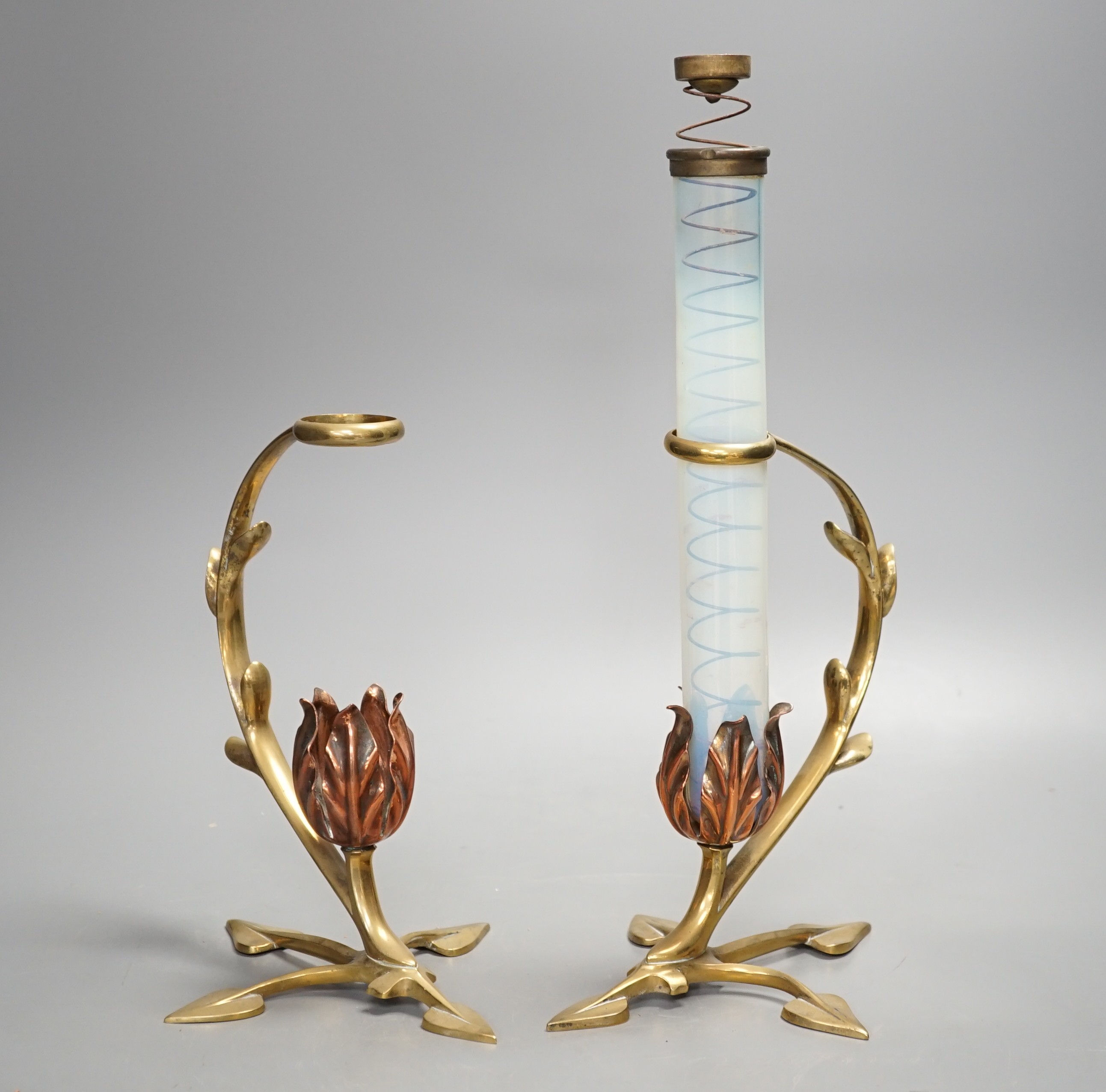 Attributed to W.A.S. Benson, a pair of brass and copper cradle lamps, one with original vaseline glass shade with candle ejector. Total height 31cm